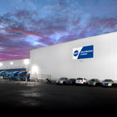 Side view of Dot Foods New York distribution center at dusk